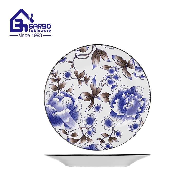 9-inch printed ceramic plate featuring an elegant white base with a detailed blue floral pattern and a contrasting black rim factory from China